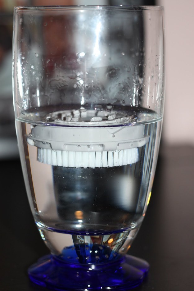 Mix baby shampoo and hydrogen peroxide with water. Unclip the brush from your Clarisonic, and let it sit brush-side down in the water for 15 minutes.